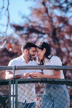 Candid moment captured of a happy couple sharing laughter on an outdoor bridge in Tigre, Argentina.