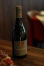 Elegant photo of Andreza Douro wine bottle on a wooden table indoors.