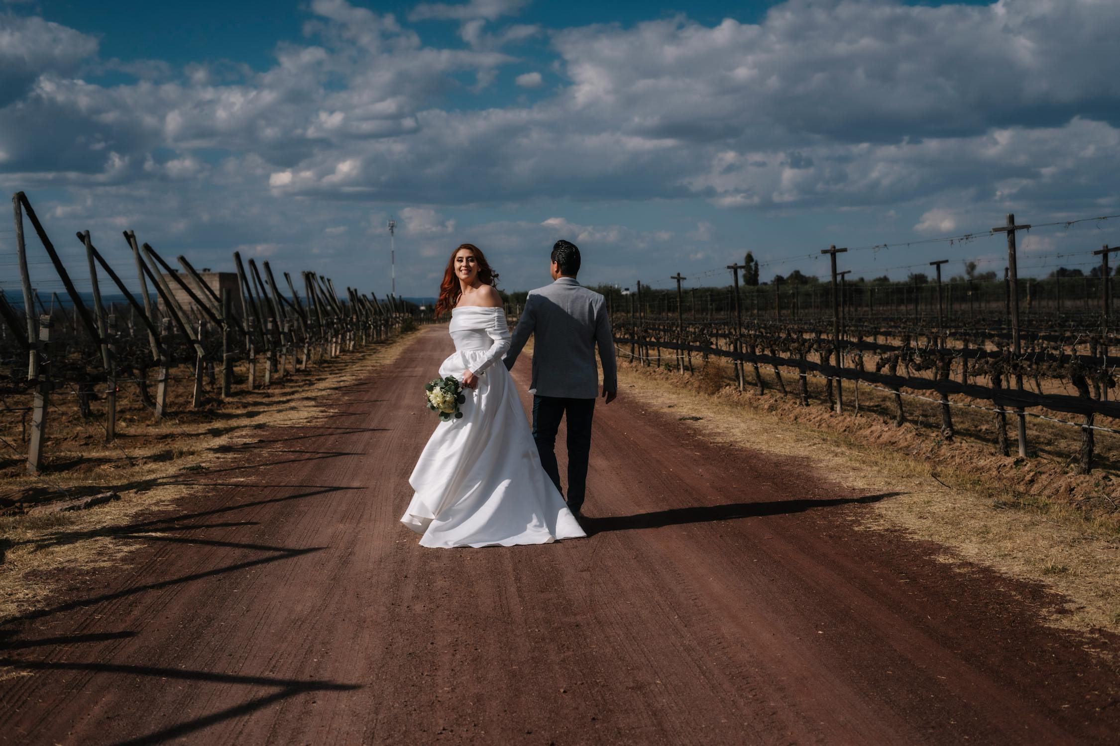 married couple wedding on dirt road