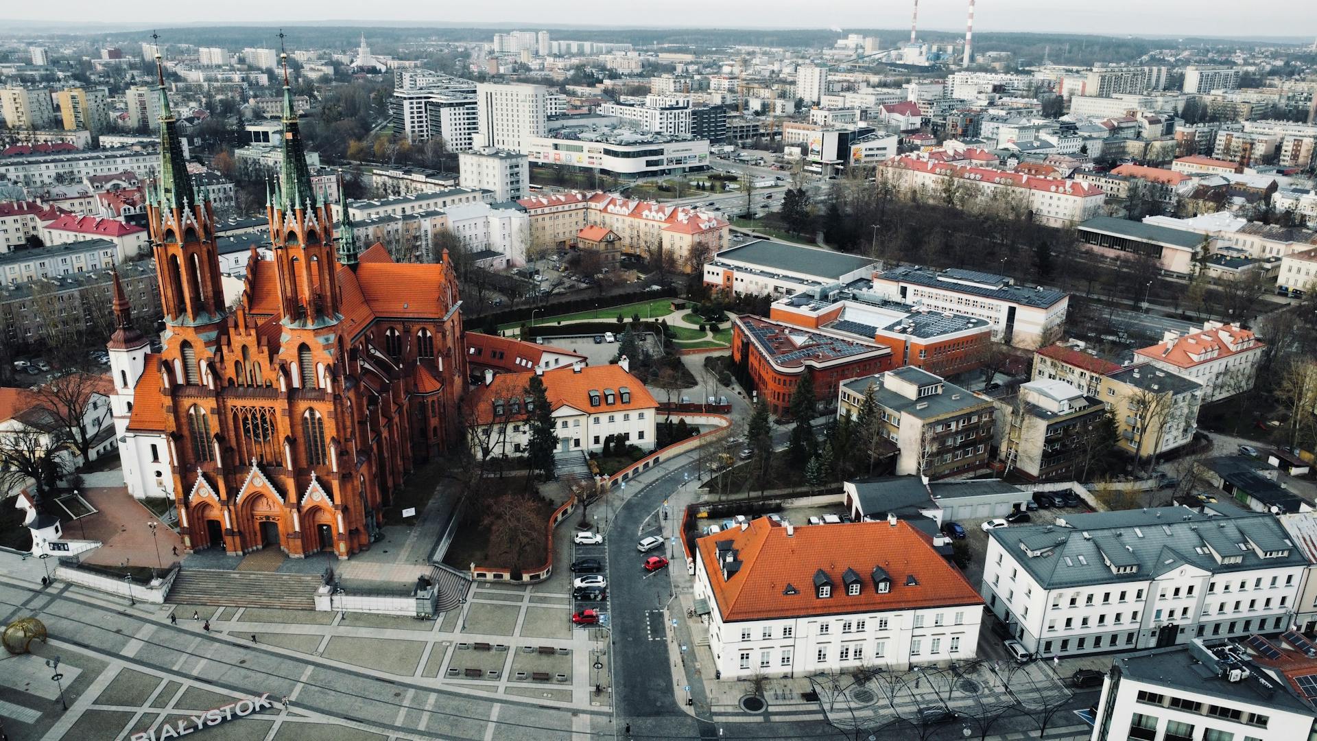 Aerial photograph of St. Roch's Basilica and surrounding cityscape in Białystok, Poland.