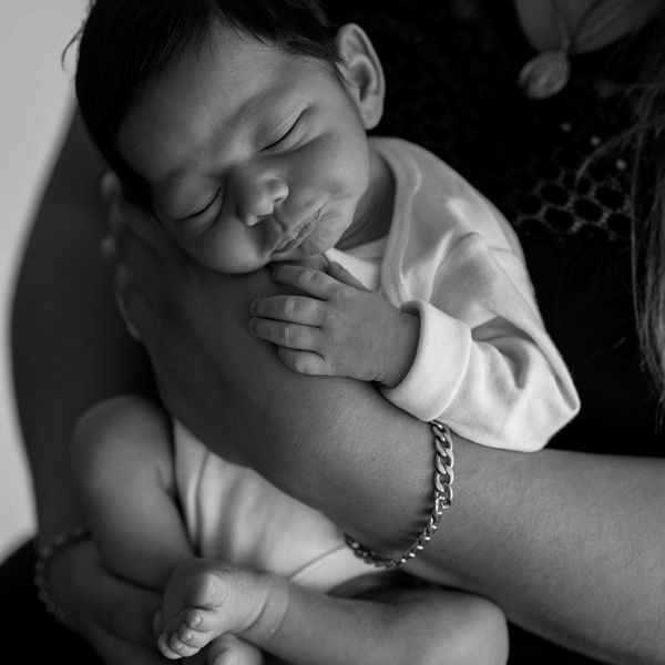 Black and white portrait of a sleeping newborn — photo by Natalia Olivera on Pexels