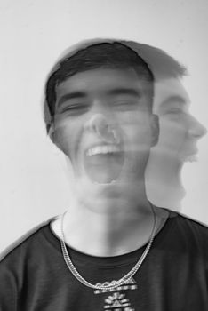 Creative black and white portrait with motion blur effect showcasing emotional expression.