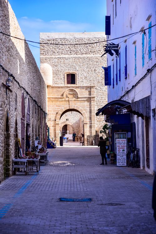 Free Discover the enchanting architecture and vibrant street scene of Essaouira's historic alleys. Stock Photo