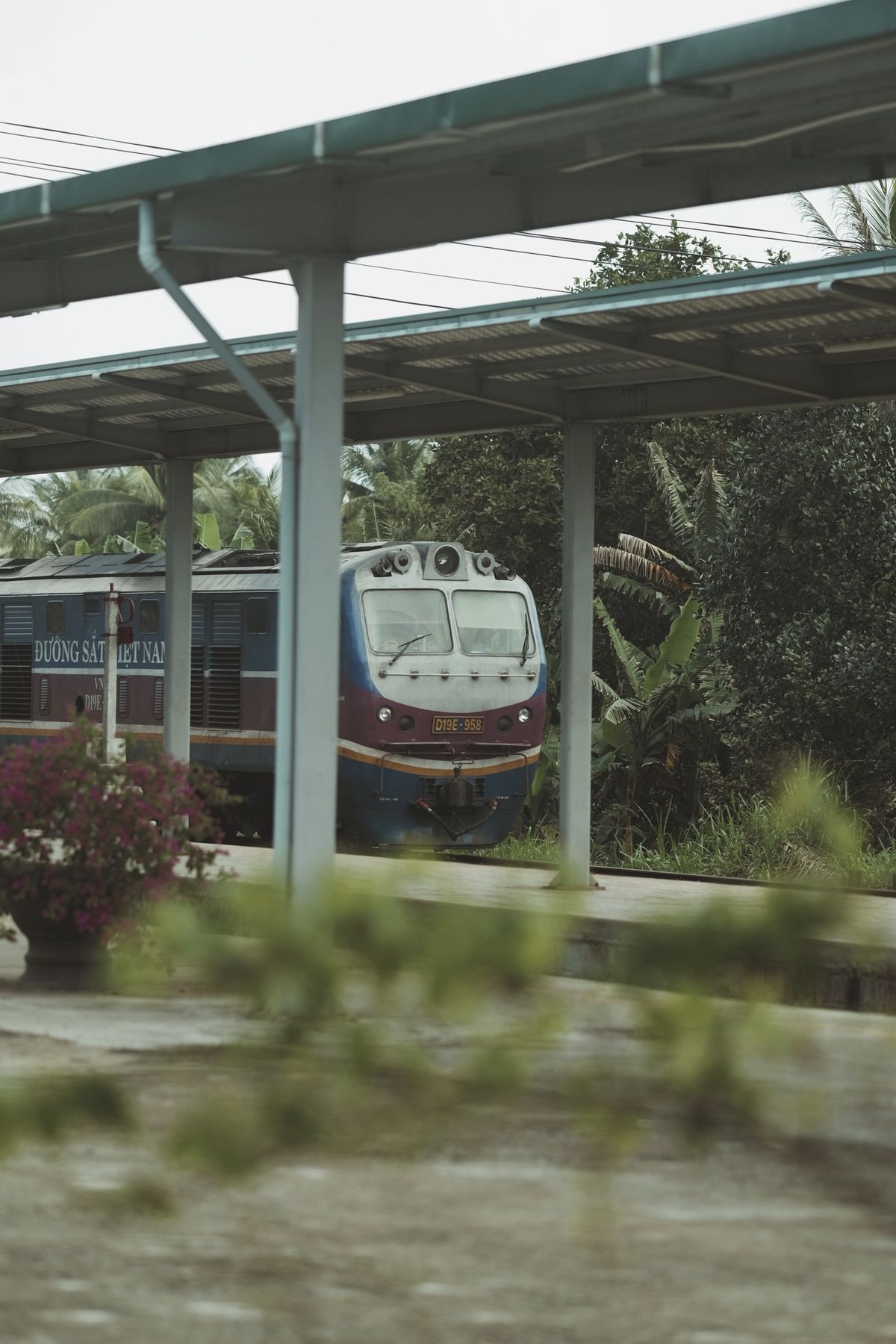 Passenger train at a railway station in Vietnam. Passenger train at a Vietnamese railway station.