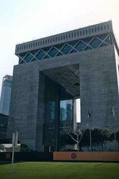 Modern high-rise building in urban business district with glass facade.