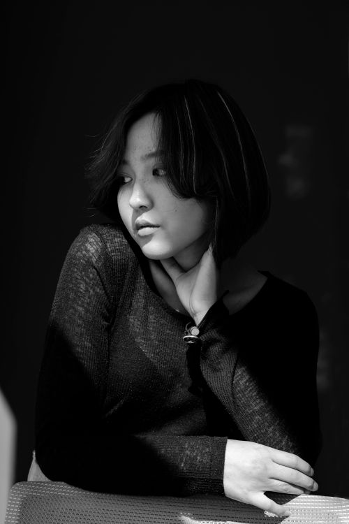 Free Stunning black and white portrait capturing a woman's contemplative expression. Stock Photo