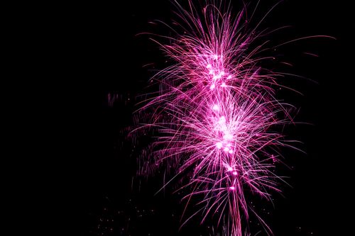 Free Colorful fireworks brighten the night sky during New Year celebration in Jönköping, Sweden. Stock Photo