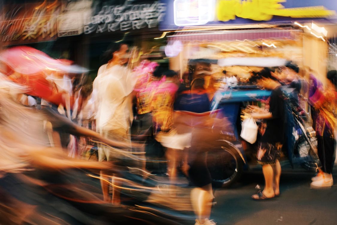 Blurred, illuminated crowd at a busy event
