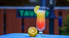 Bright citrus cocktail with lemon slice, perfect for summer vibes.