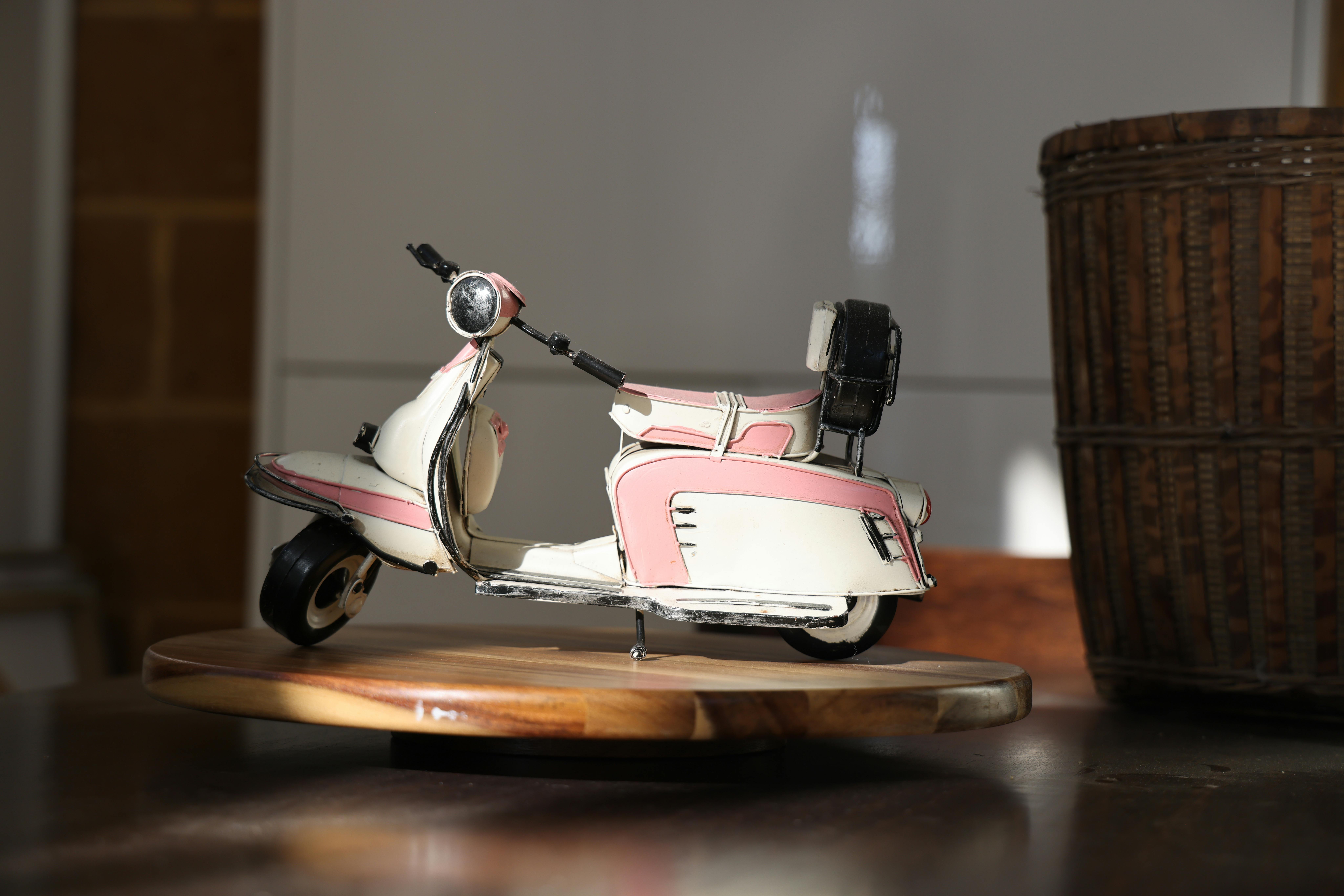 vintage pink scooter miniature model on display
