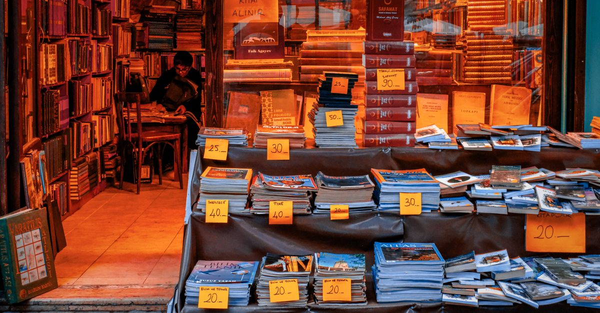 Book Rice Tag Cozy bookstore with vintage book display in shop window ยท Free Stock Photo