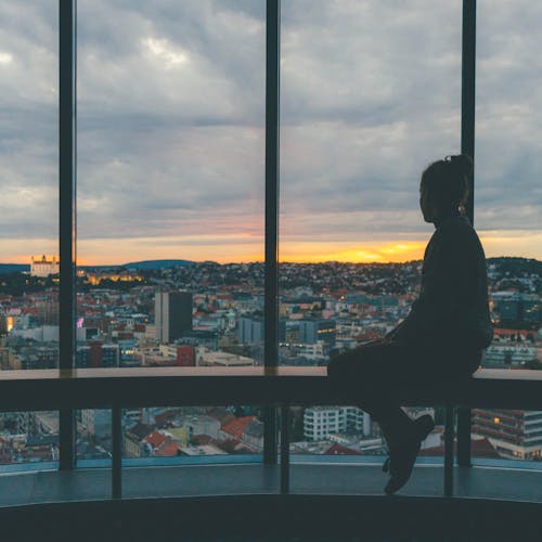 Woman Near Window