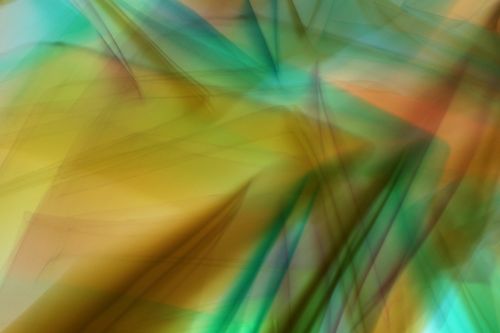 Free Abstract image with vibrant light and color patterns in shades of green, yellow, and orange. Stock Photo