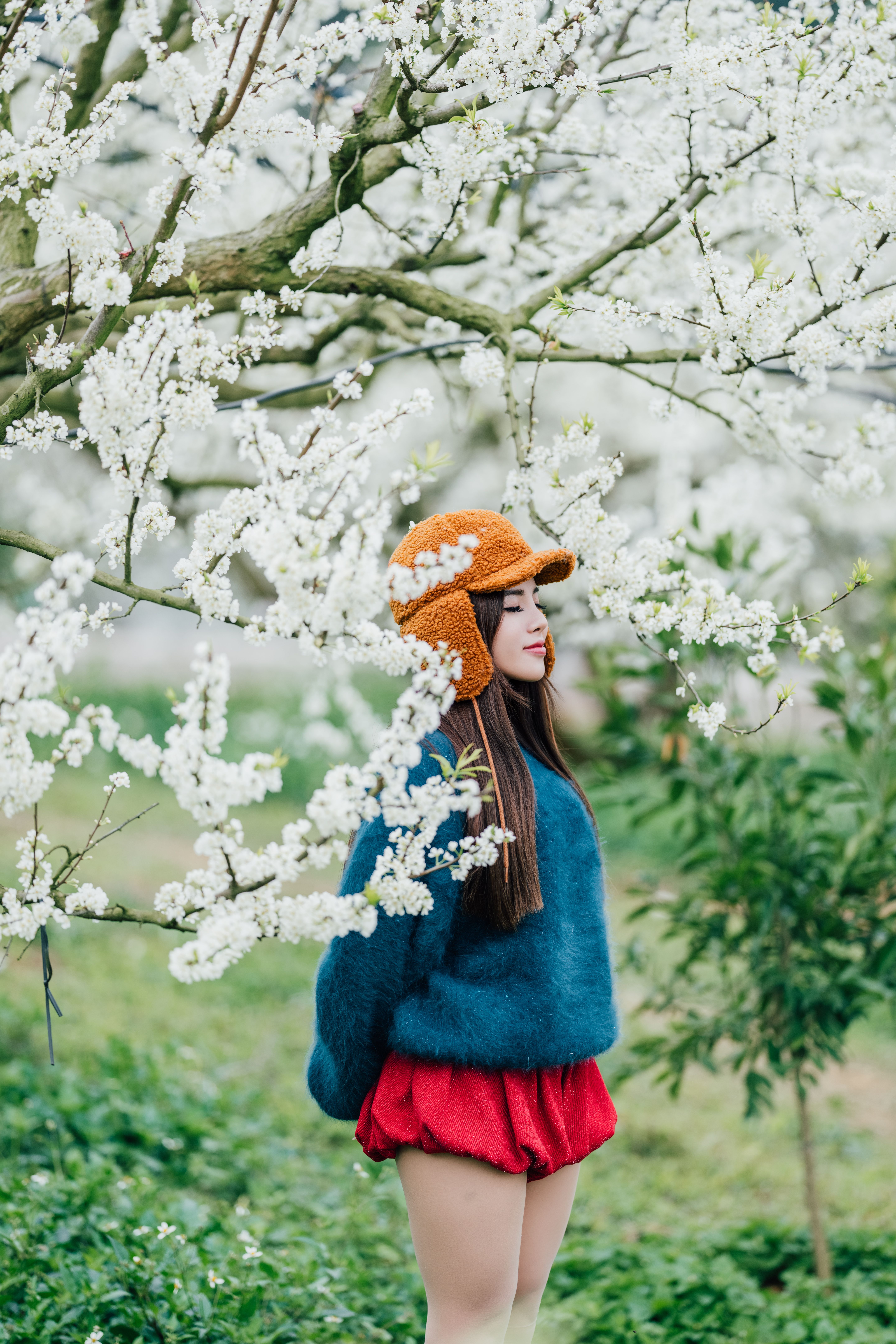 Woman Enjoys Springtime Bloom in Nature · Free Stock Photo