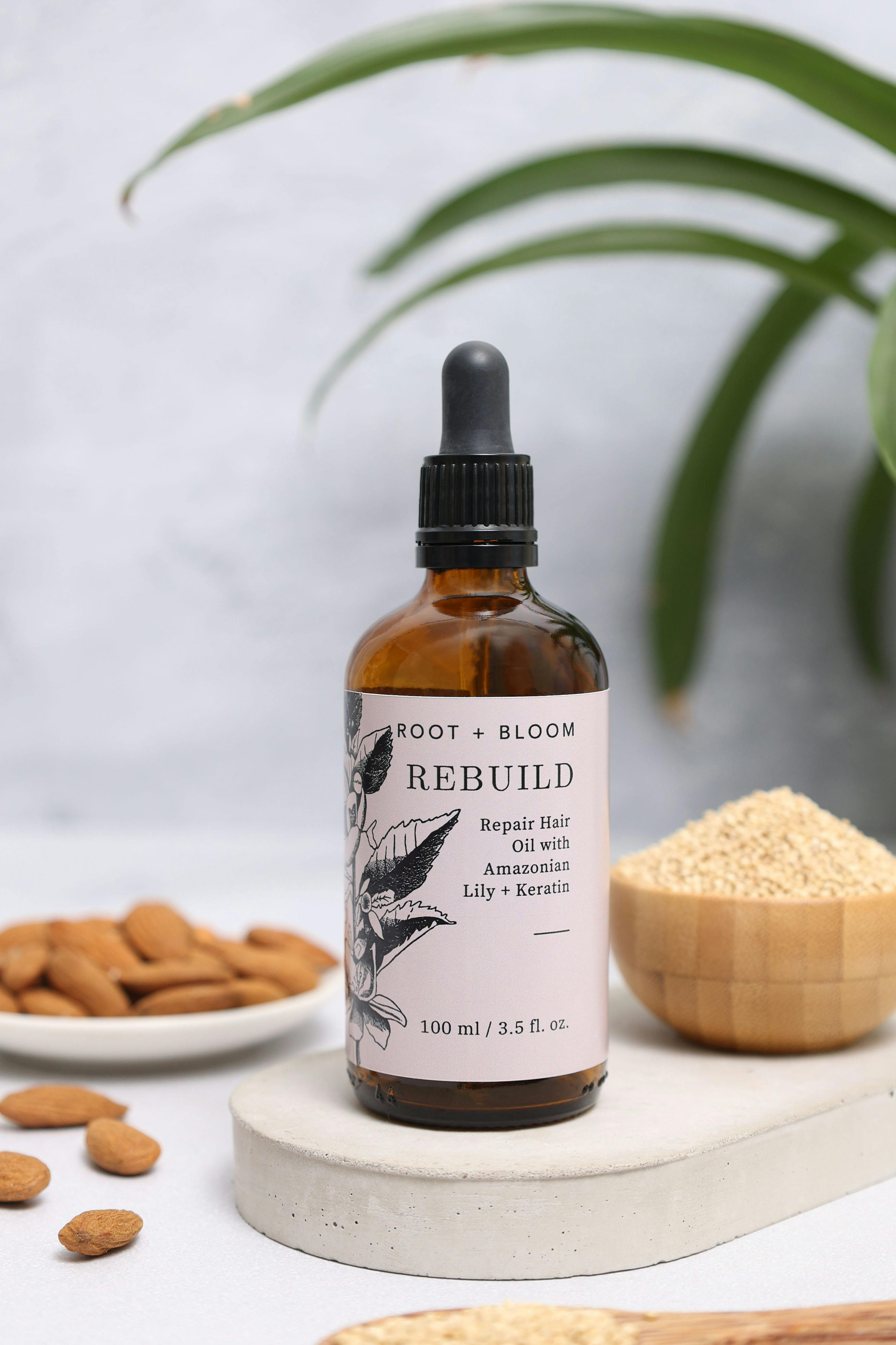 Rebuild hair oil for strengthening hair with Amazonian Lily and Keratin. Perfect for natural hair care routines.