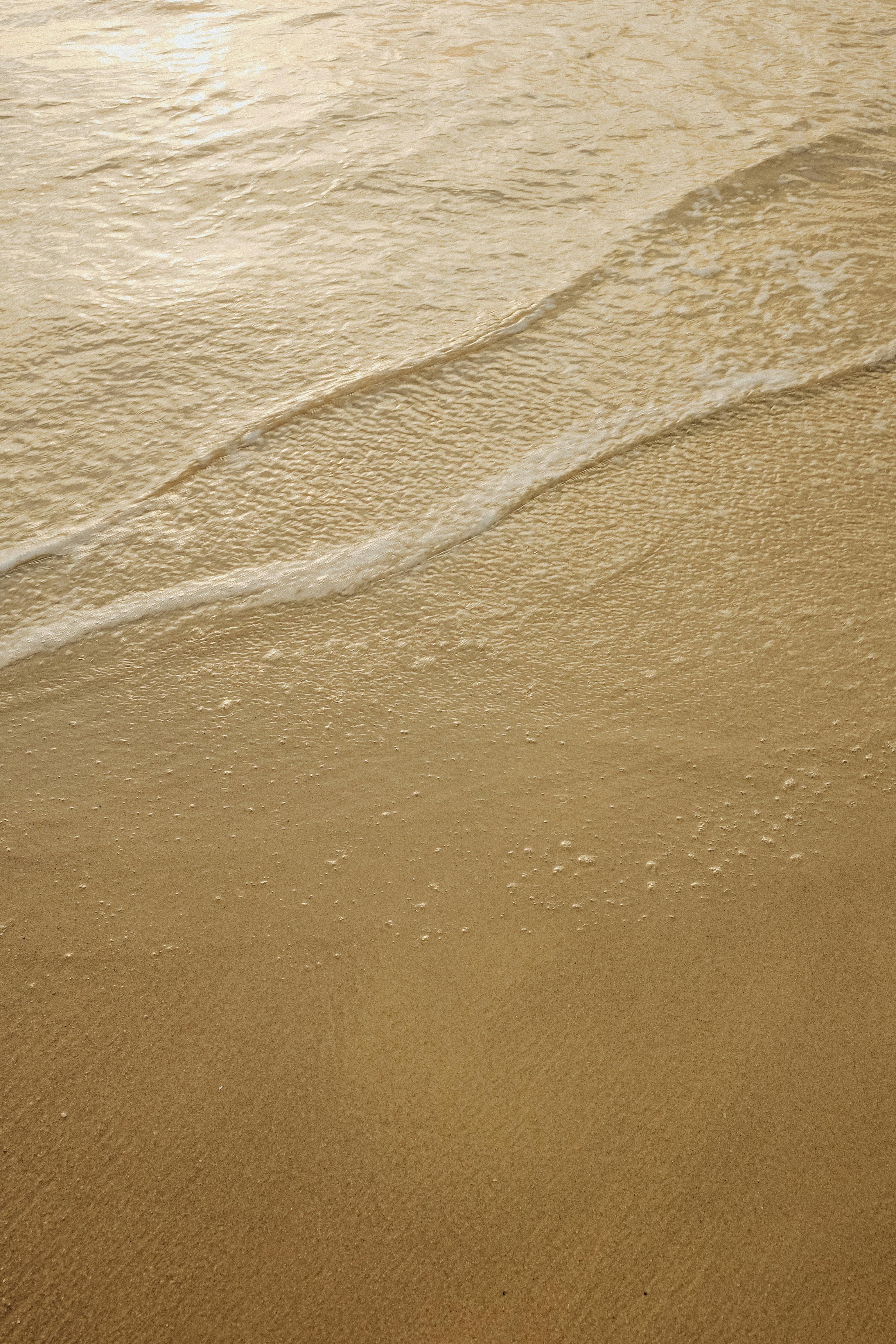 golden beach waves at sunset in niteroi brazil