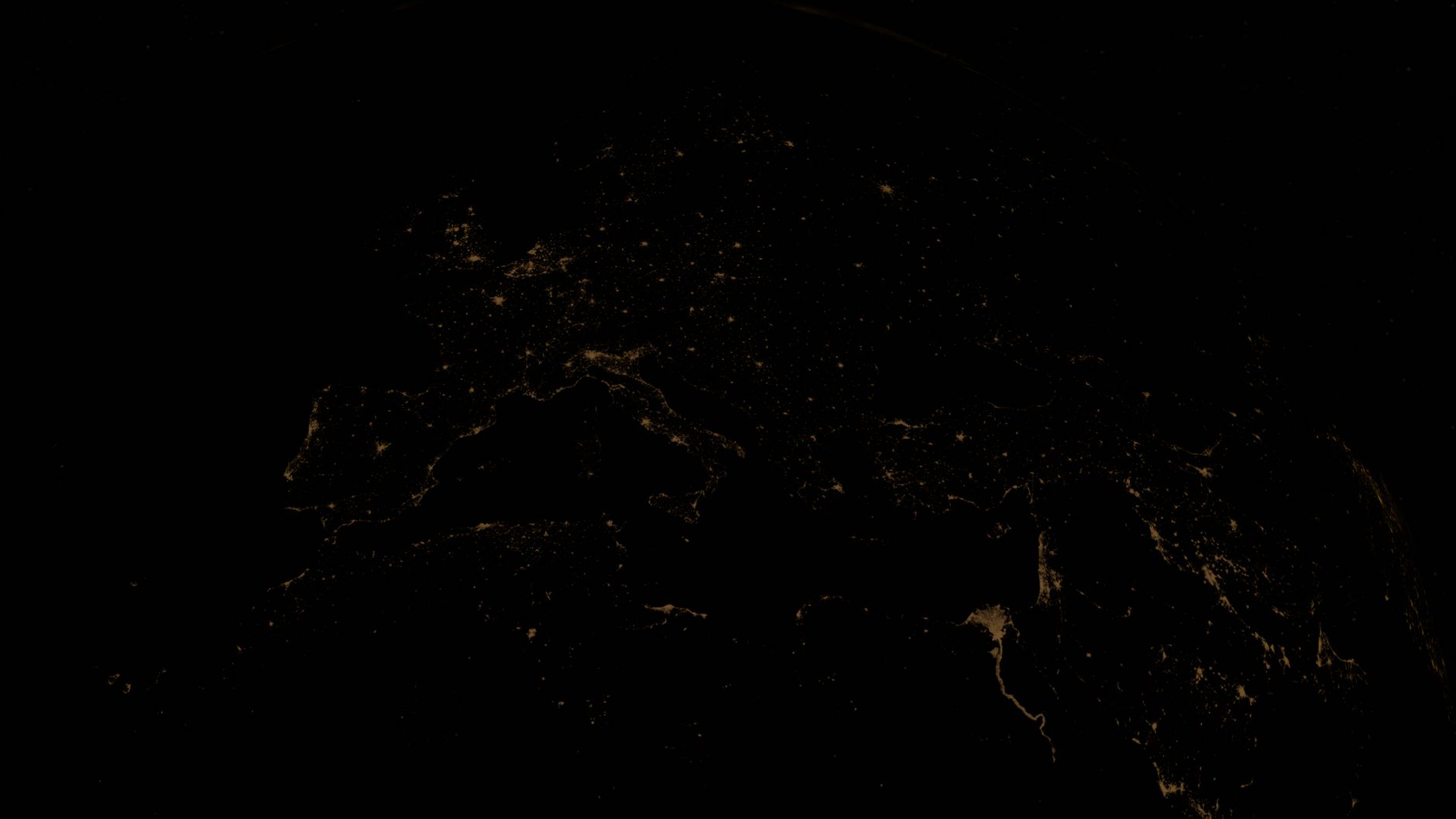 Stunning view of Earth's city lights at night from space, highlighting urban areas.