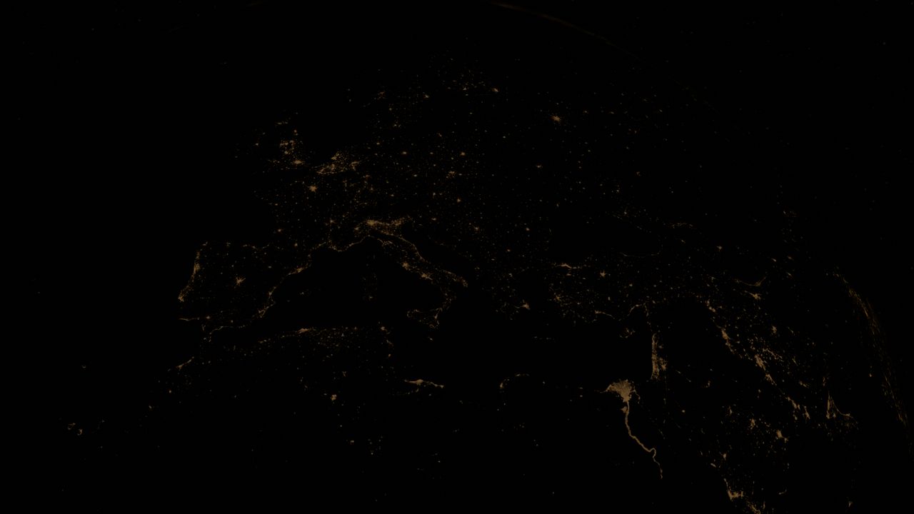 Stunning view of Earth's city lights at night from space, highlighting urban areas