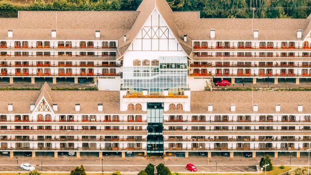 Aerial shot of a luxurious mountain hotel with European architectural style in Campos do Jordão, Brazil.
