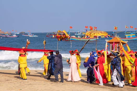 A colorful traditional festival procession along Quy Nhơn's beach with vibrant costumes and cultural elements.