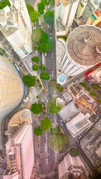 Bird's-eye view of city streets and skyscrapers, showcasing urban architecture and vibrant city life.