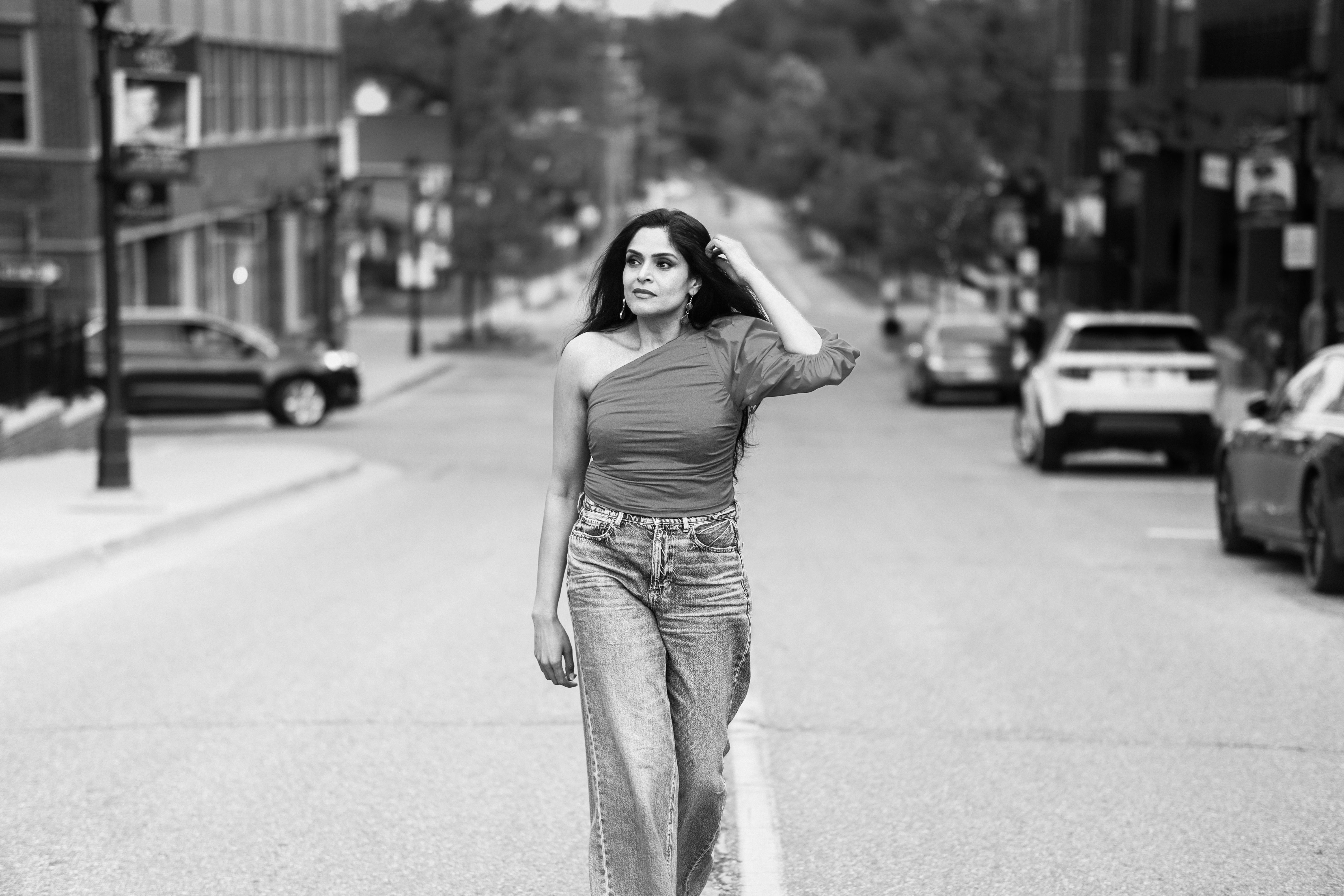 stylish woman walking on urban street