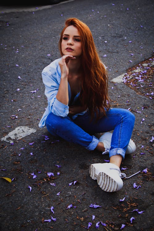 Photo Of Woman Sitting On Road