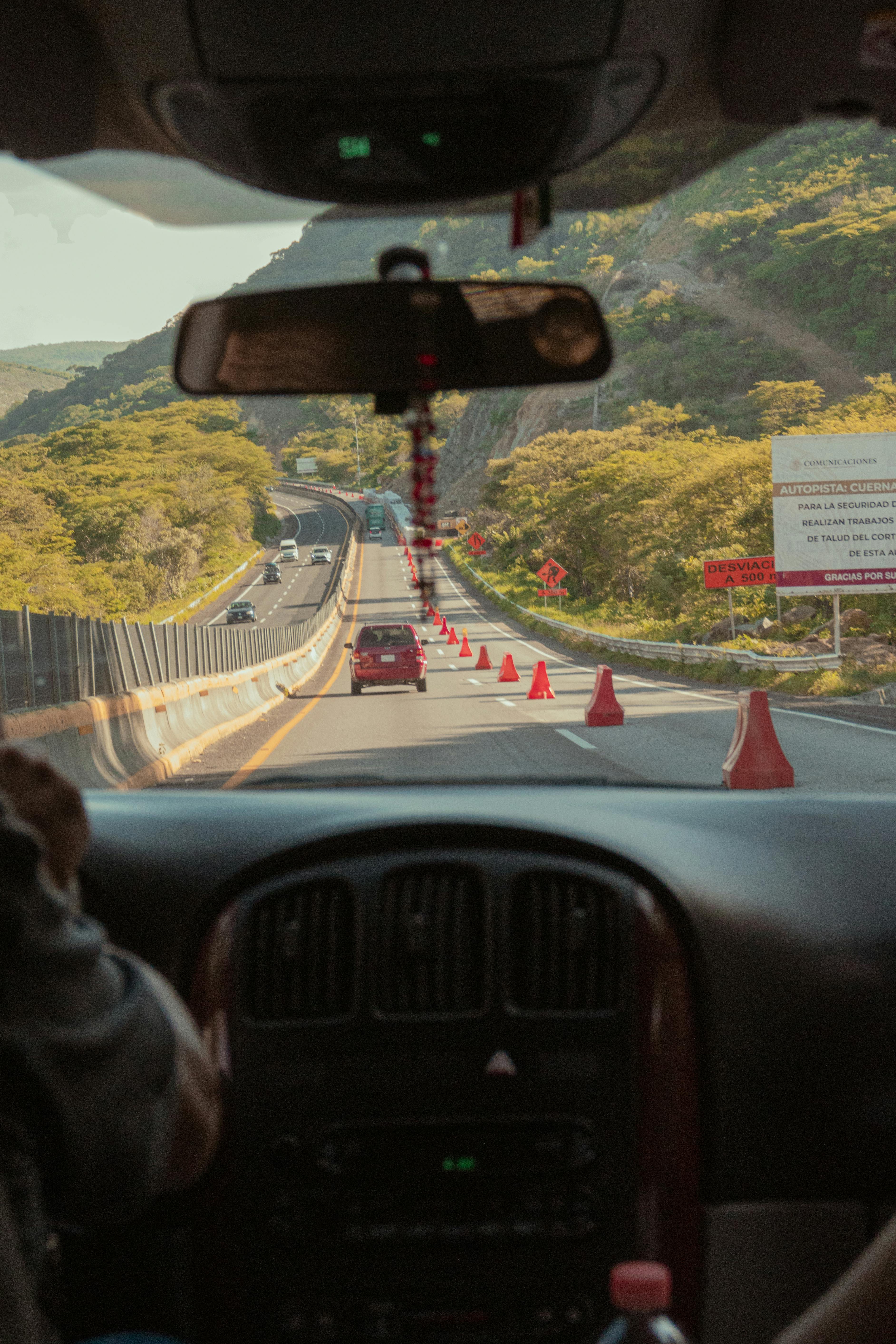 View from car interior of a road trip through Mexican mountains.