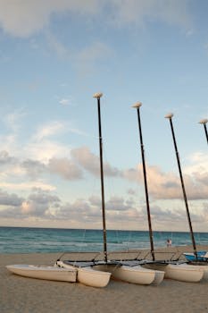 Serene view of sailboats lined up on Varadero Beach, Cuba, during a breathtaking sunrise.