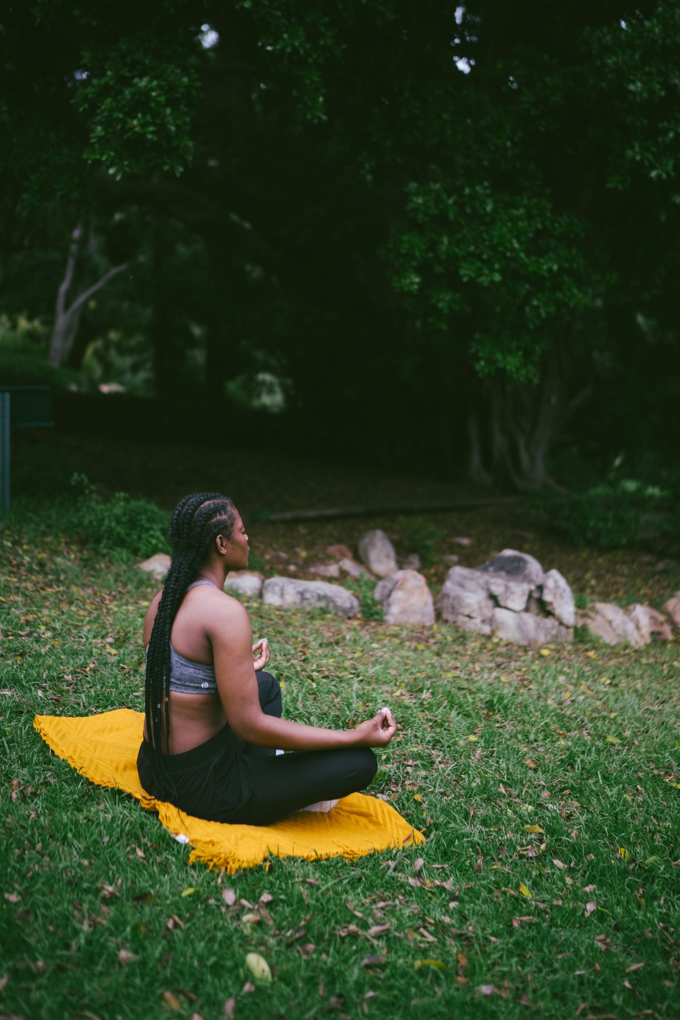 Woman practicing calm, grounded wellness outdoors