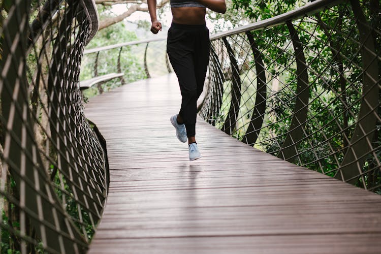 Photo Of Person Running On Bridge