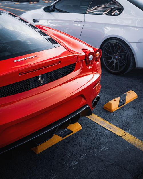 Free Close-up of a sleek red Ferrari parked outdoors in Ankara, Turkey. Stock Photo