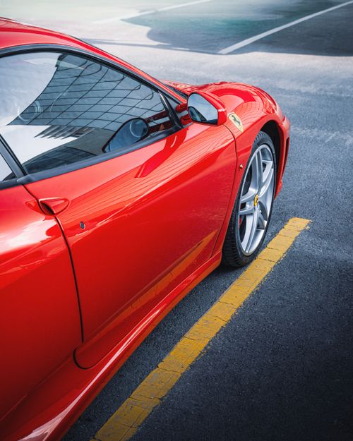 Free Vibrant red sports car elegantly parked in Ankara, Turkey showcasing modern luxury design. Stock Photo
