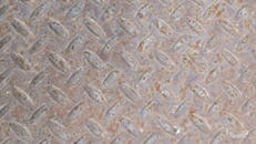 Close-up of Rusty Metal Diamond Plate Texture