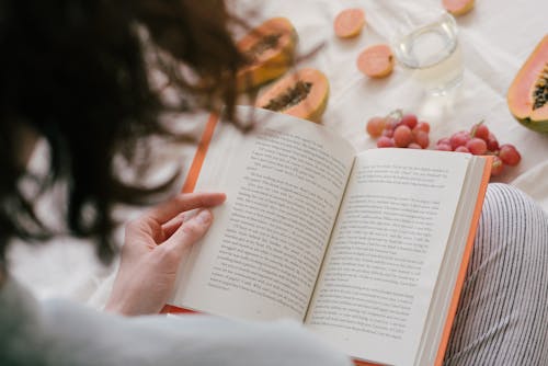 Free Person Reading A Book Stock Photo