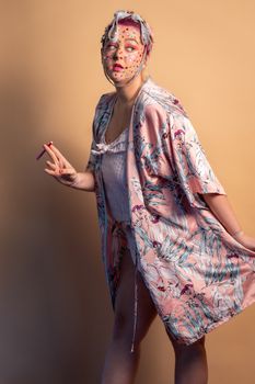 Portrait of a woman in a colorful kimono, artistic makeup, motion pose.