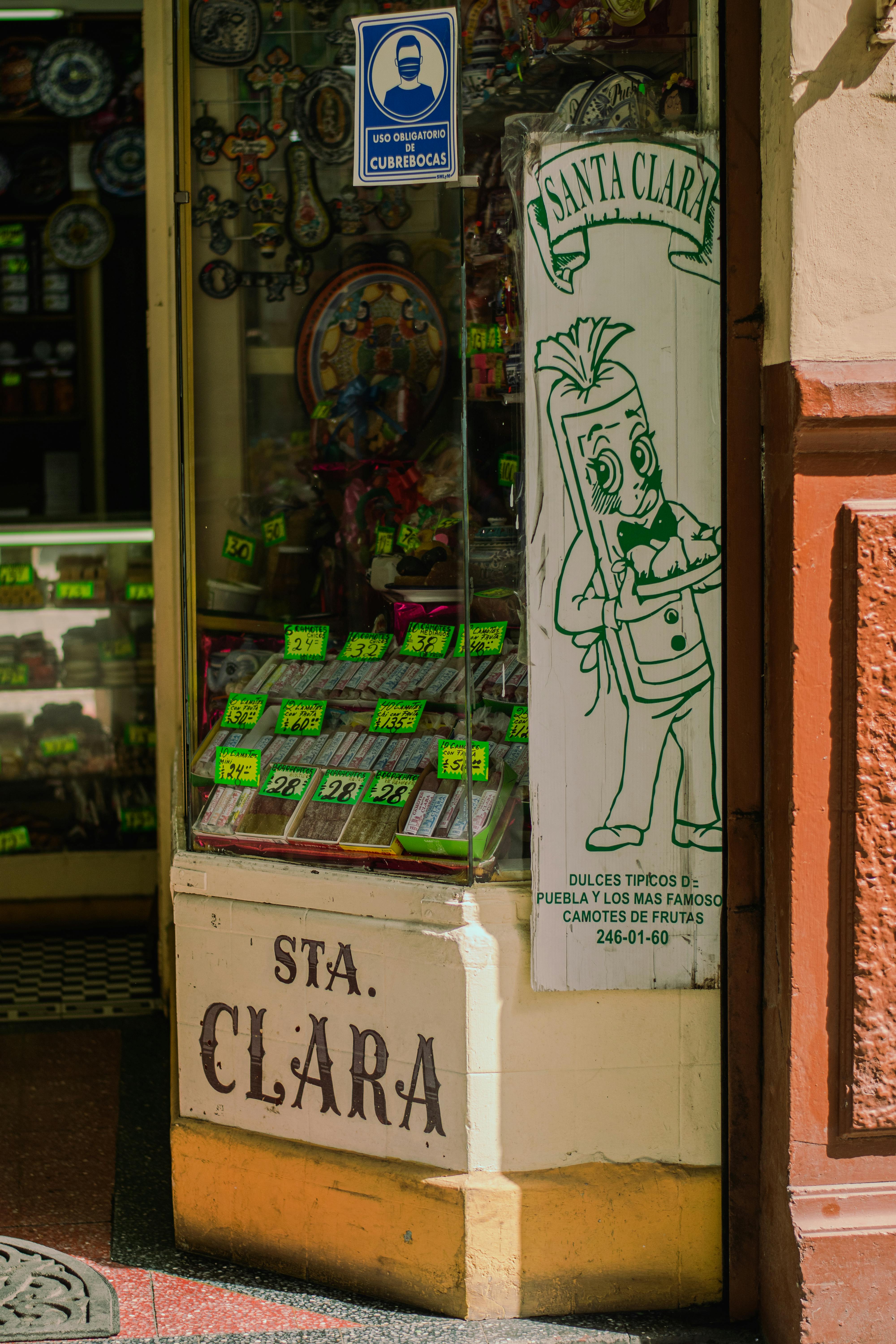 Nostalgic candy shop front with vintage signage in warm lighting.