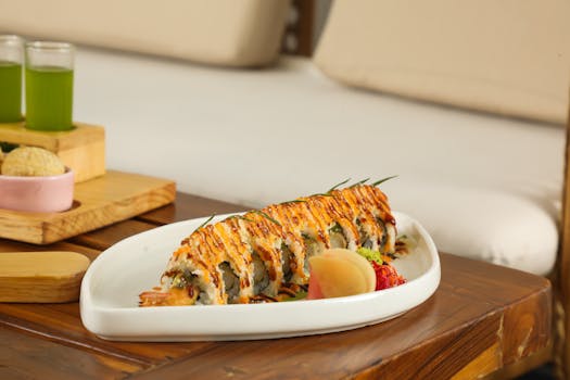 Close-up of a sushi roll platter with sauces on a wooden table, perfect for food photography.
