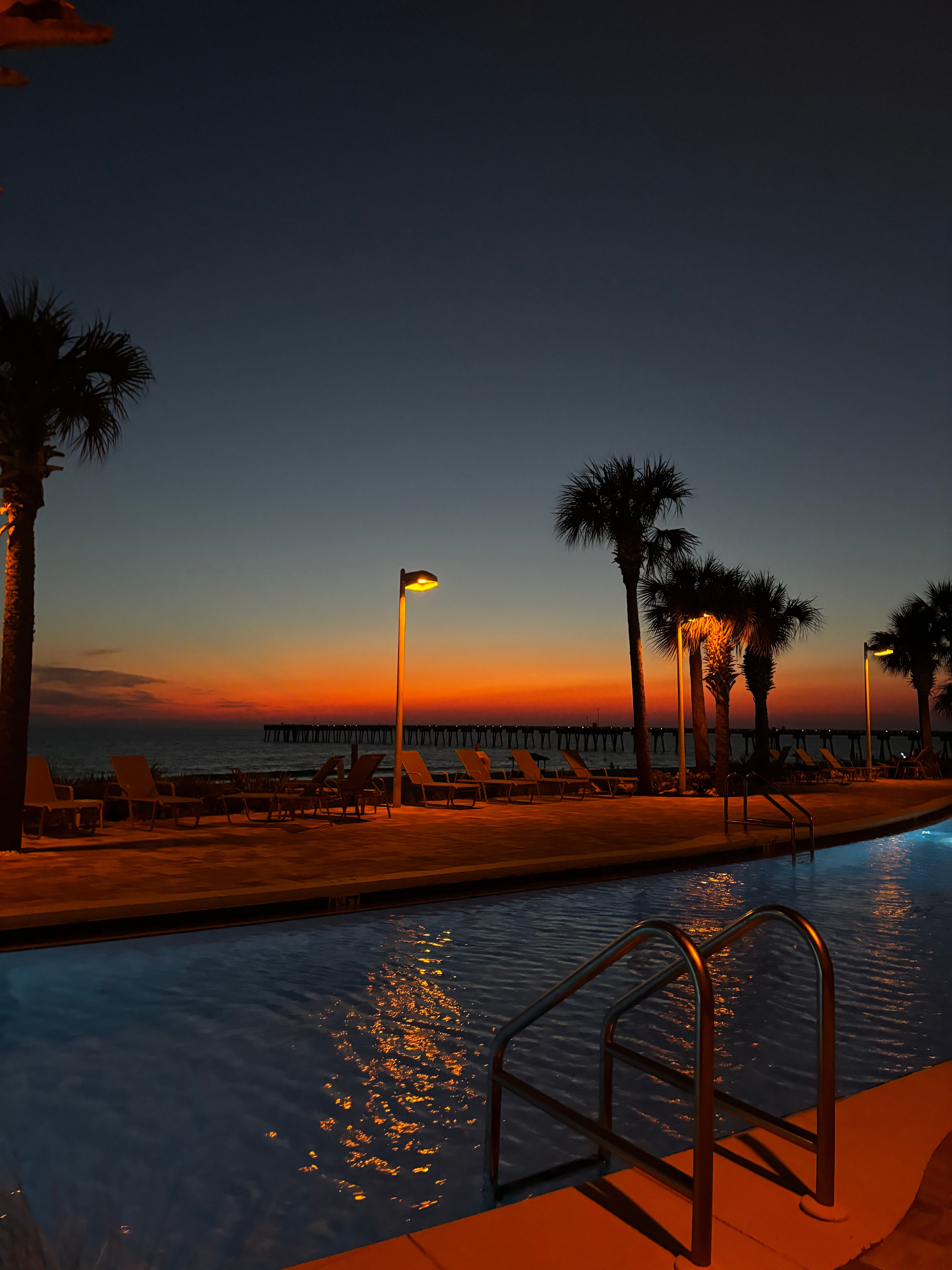 Beautiful Sunset by the Palm Beach Pool · Free Stock Photo
