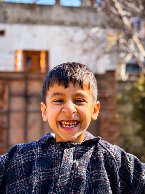 Free A happy boy enjoying a bright sunny day outdoors, radiating joy and warmth. Stock Photo