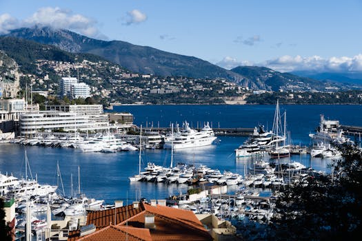 Breathtaking view of Monaco marina with luxurious yachts and scenic backdrop.