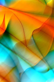 An artistic image showcasing vivid, colorful abstract light patterns with smooth curves and waves.