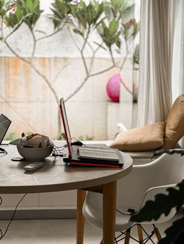 Cozy contemporary home office setup with natural light and lush indoor plants in Liverpool.