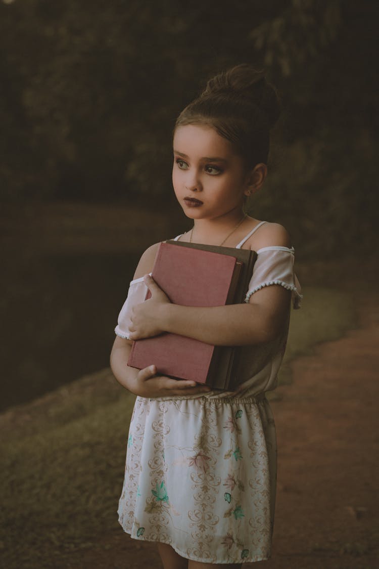 Girl Holding Books