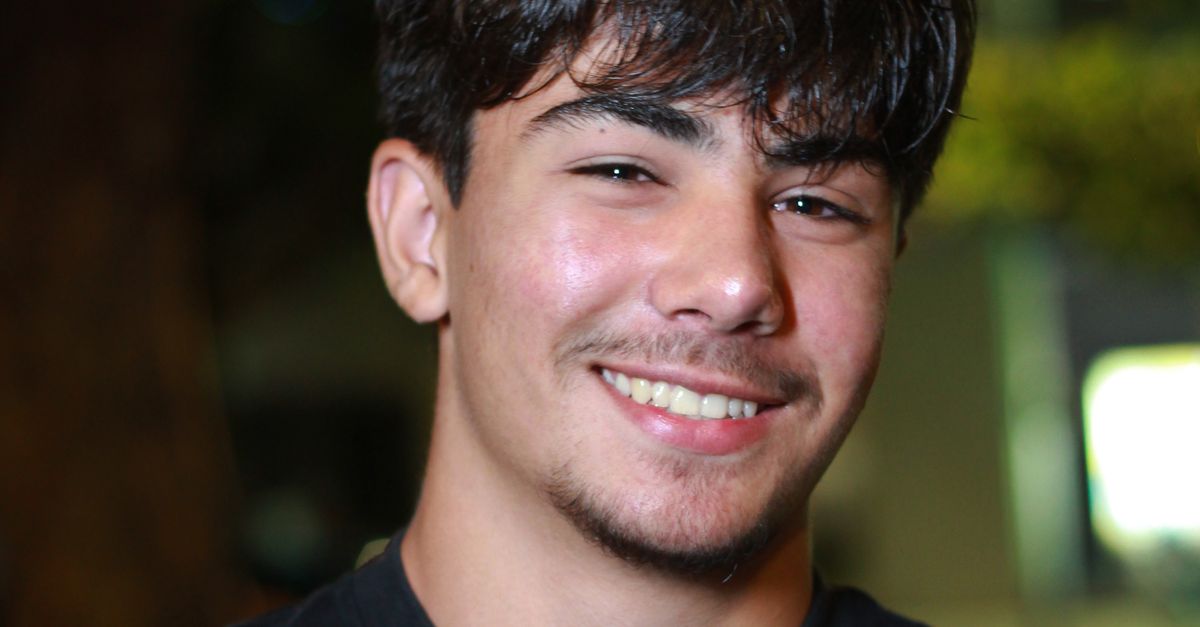 Young Man Smiling Outdoors At Night Free Stock Photo young-man-smiling-outdoors-at-night-free-stock-photo