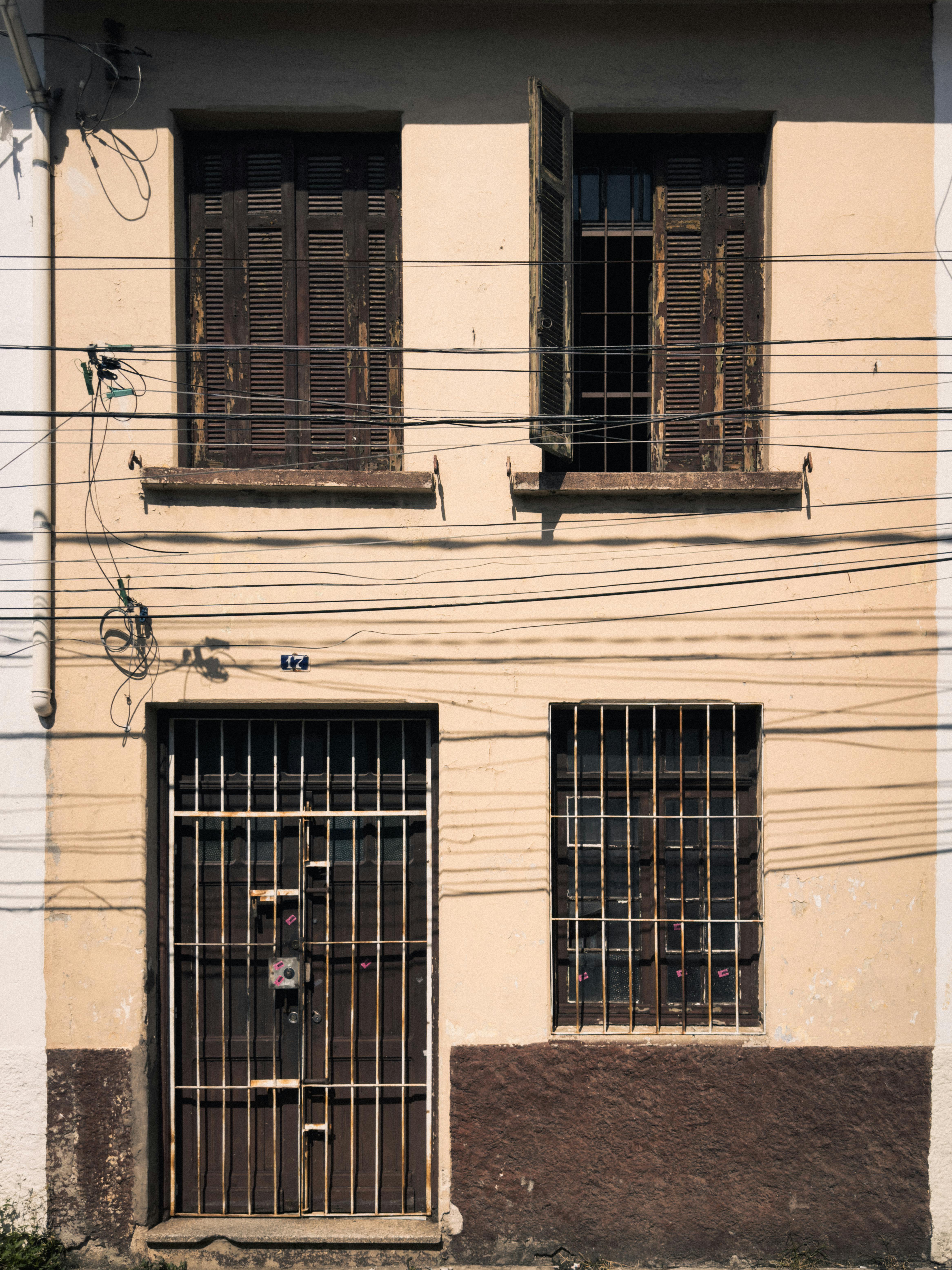 rustic urban building facade with iron bars