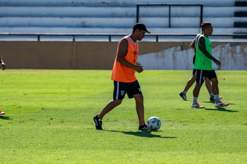Free Athletes practice soccer on a sunny day, showcasing teamwork and skills. Stock Photo