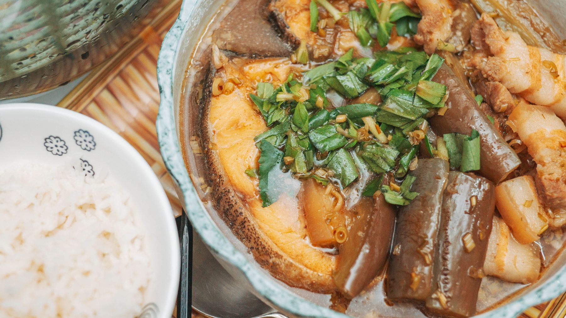 A mouthwatering Vietnamese braised fish dish with eggplant and rice.