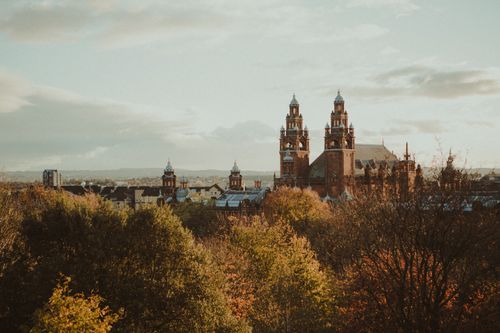 Free Scenic view of Kelvingrove Museum surrounded by autumn foliage in Glasgow, Scotland. Stock Photo