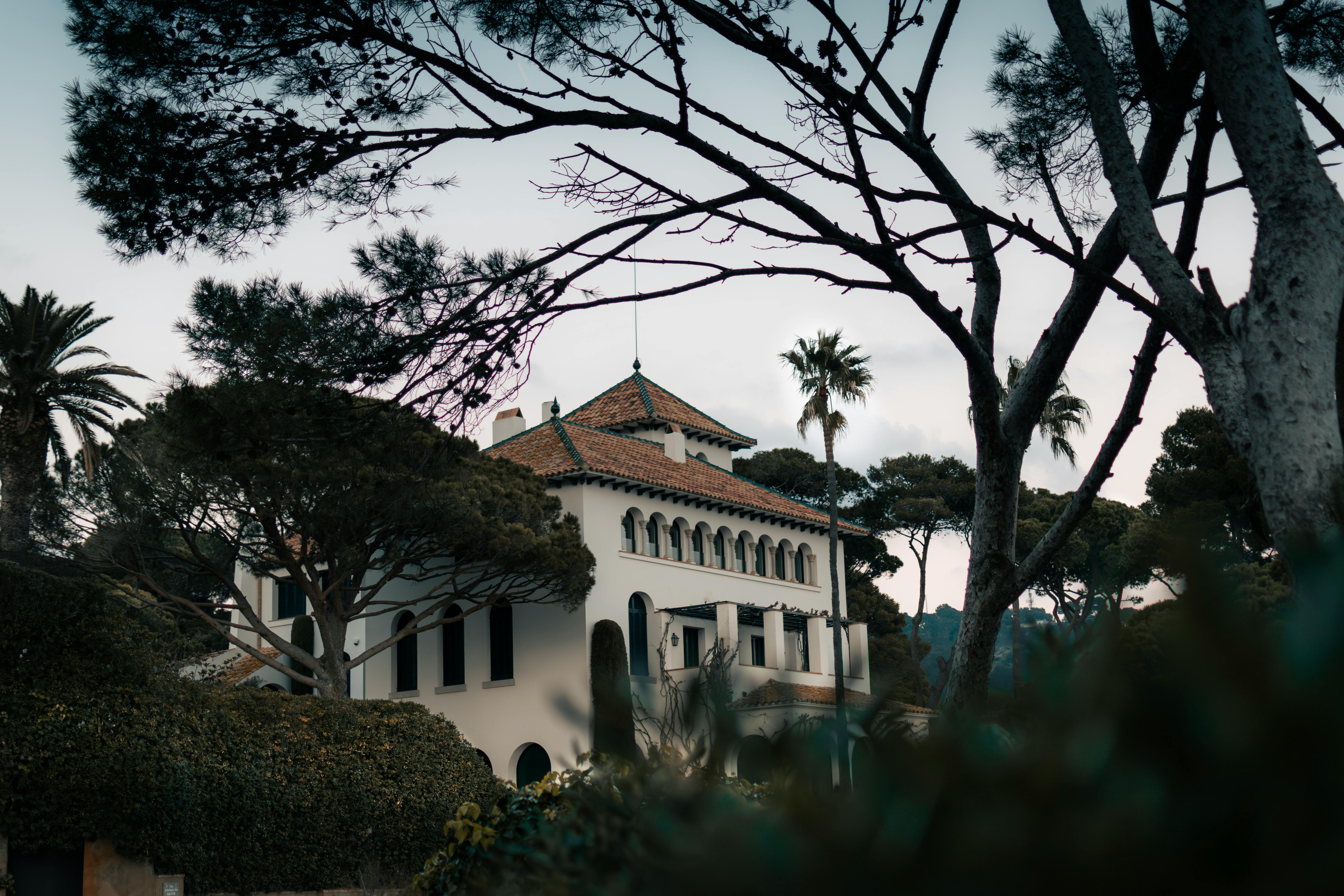 Elegant villa surrounded by Mediterranean greenery in Catalonia, Spain.